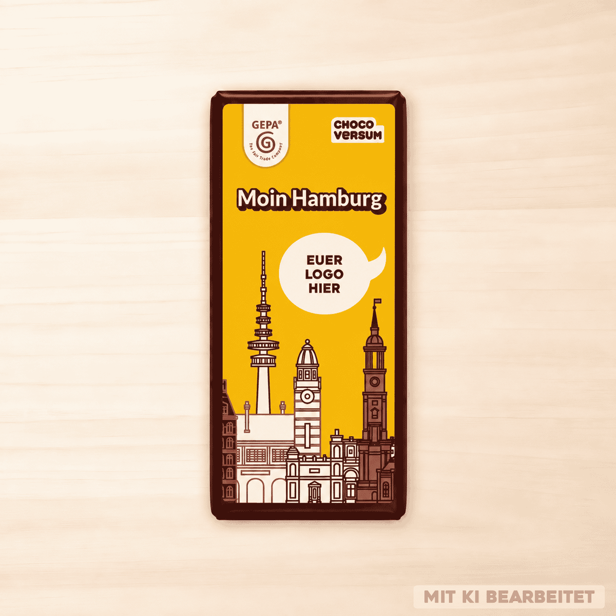 GEPA Bio-Zartbitterschokolade „Moin Hamburg“ mit gelber Banderole, Hamburger Wahrzeichen und Platzhalter für ein individuelles Logo.