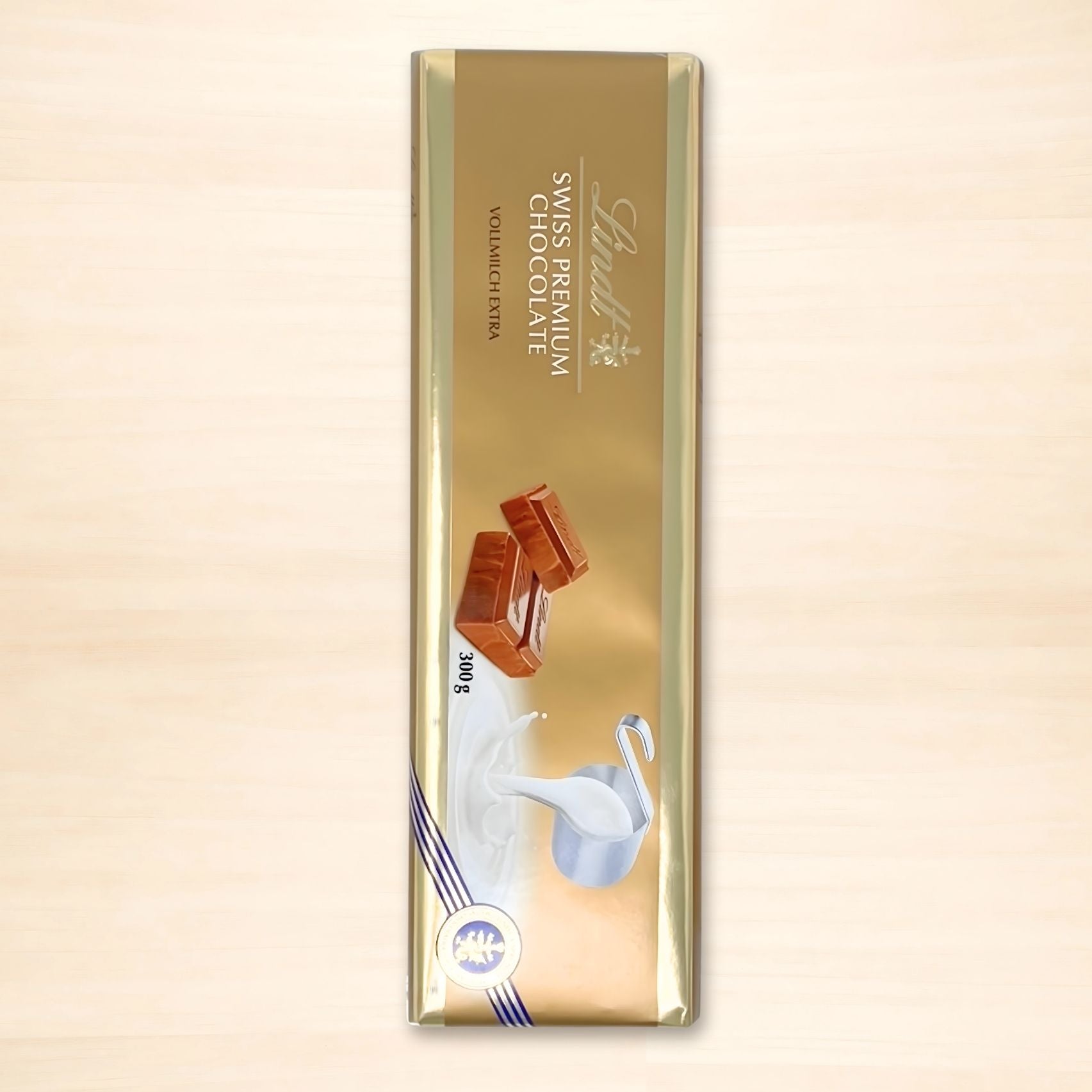 Lindt Alpenvollmilch Extra Vollmilchschokolade 300 g in goldener Verpackung