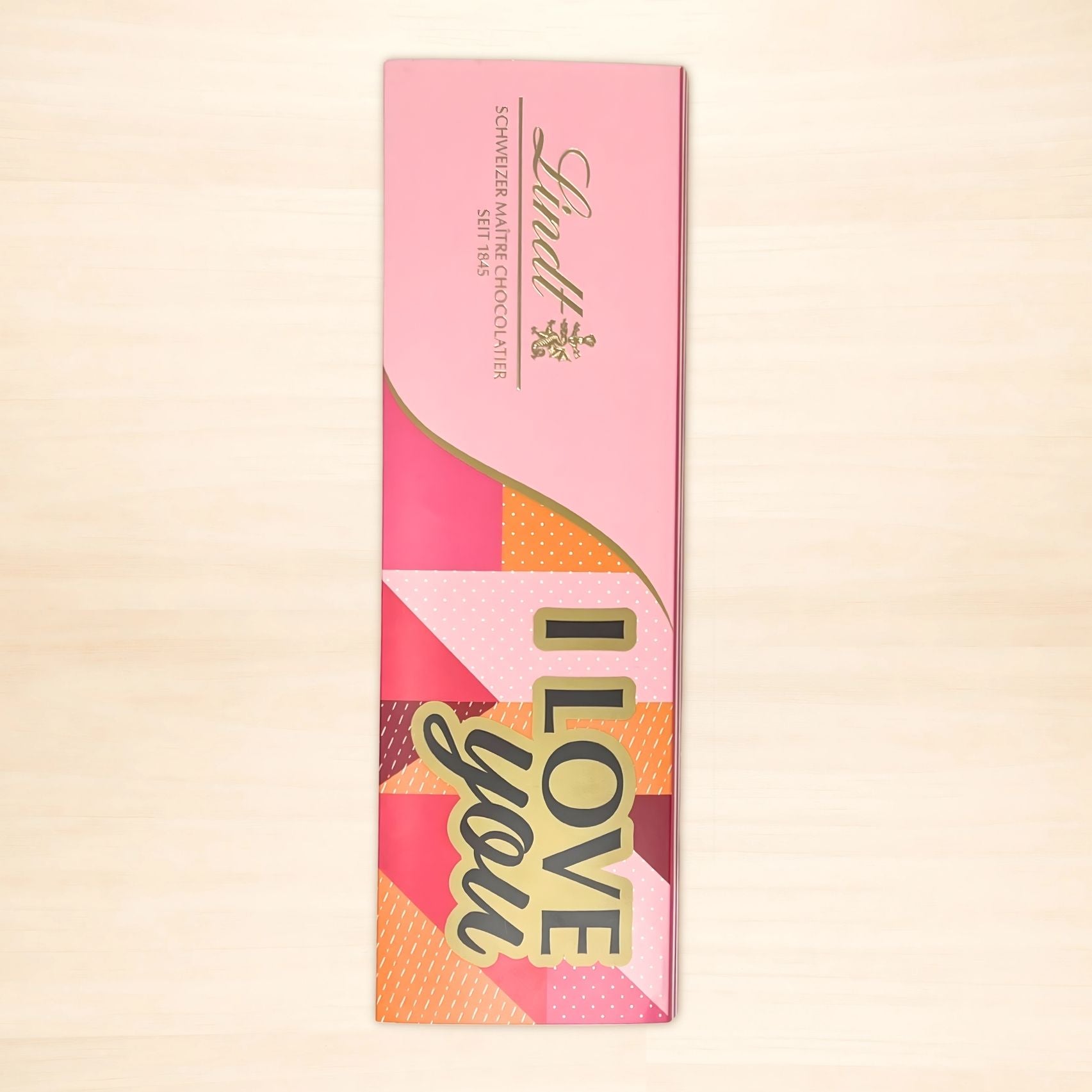 Rosa Lindt Geschenkverpackung mit Schriftzug „LOVE you“ für Lindt Alpenvollmilch Extra Tafel, 300g